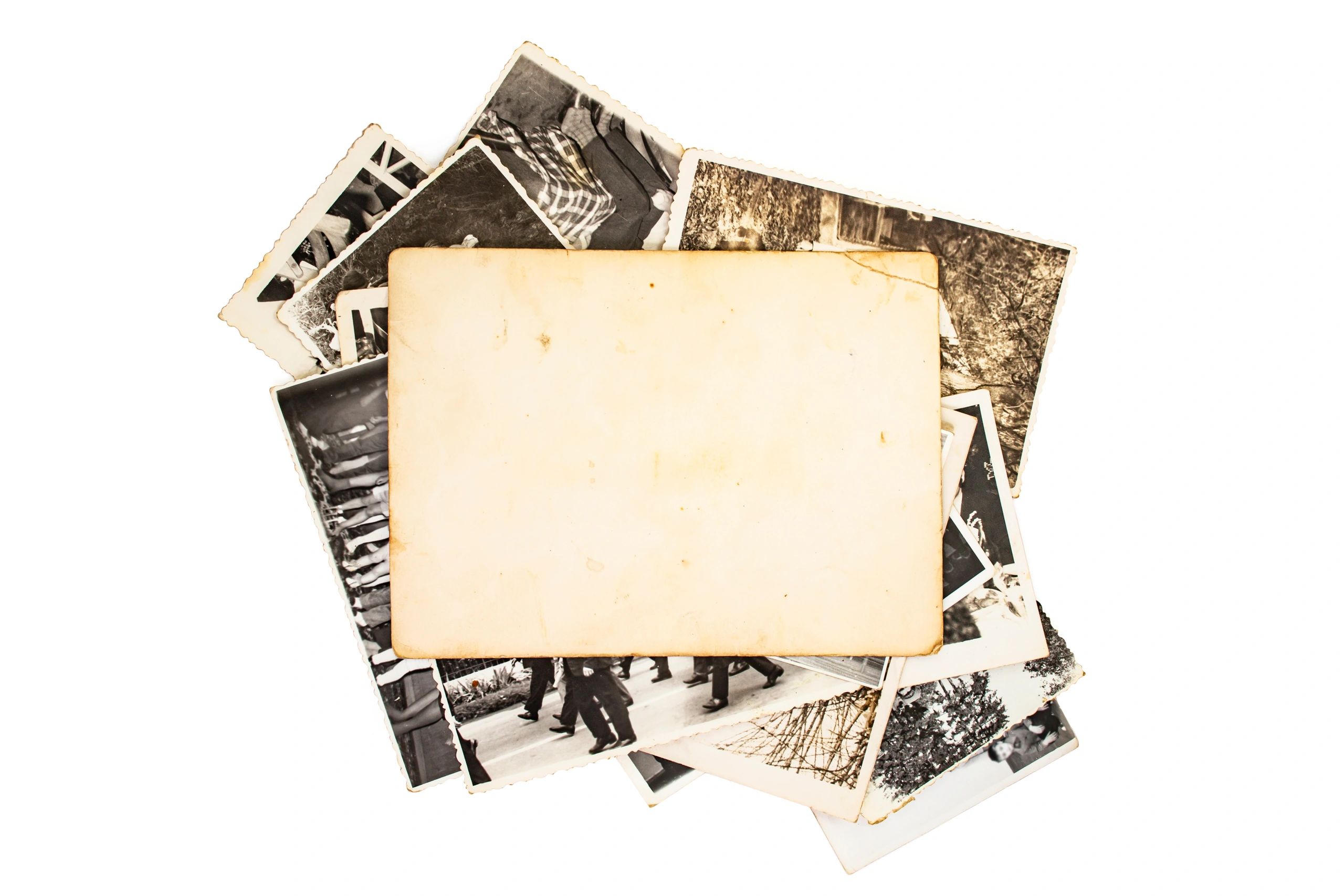 Stack of old photographs symbolizing archived family records