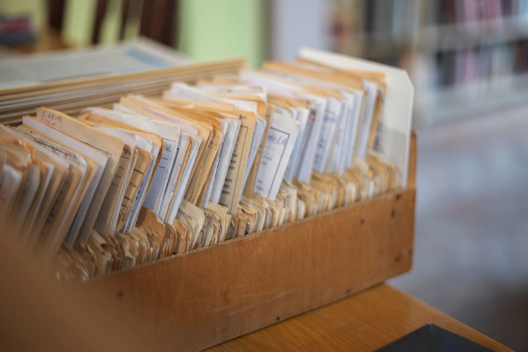 Old library card catalog drawer with records